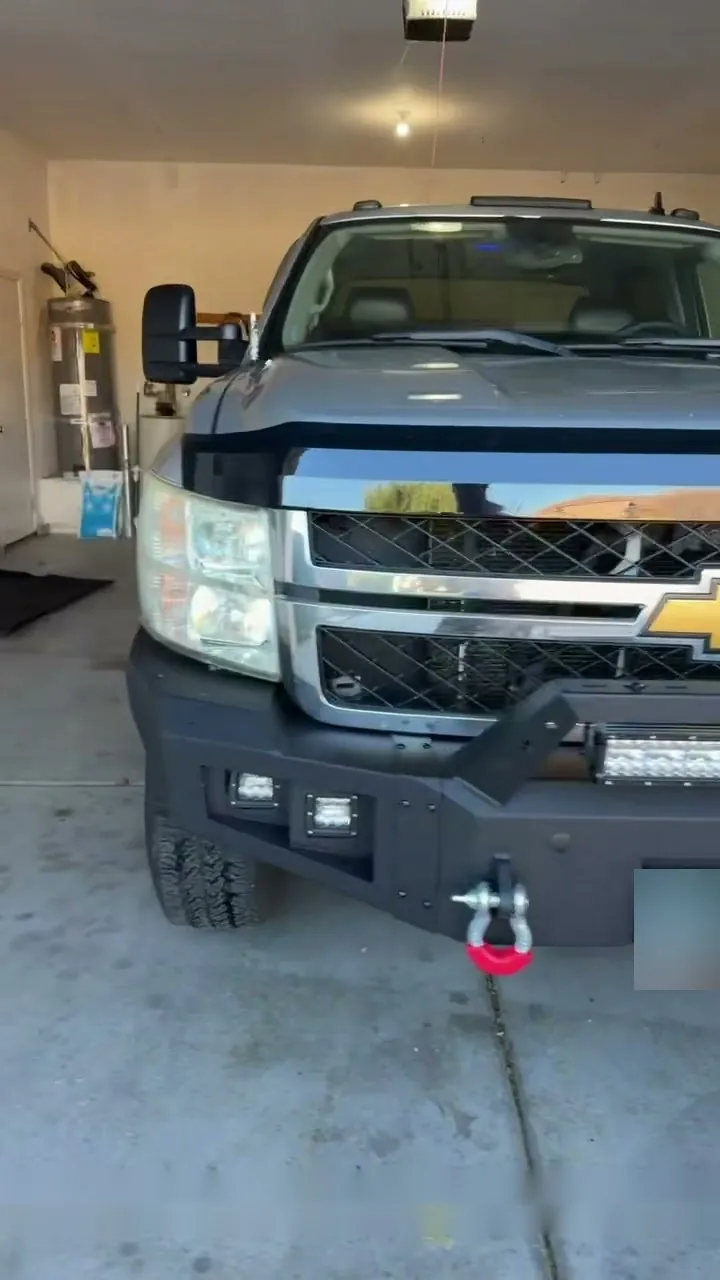 A gray Chevy Silverado HD in a garage after a PMV Detailing detail